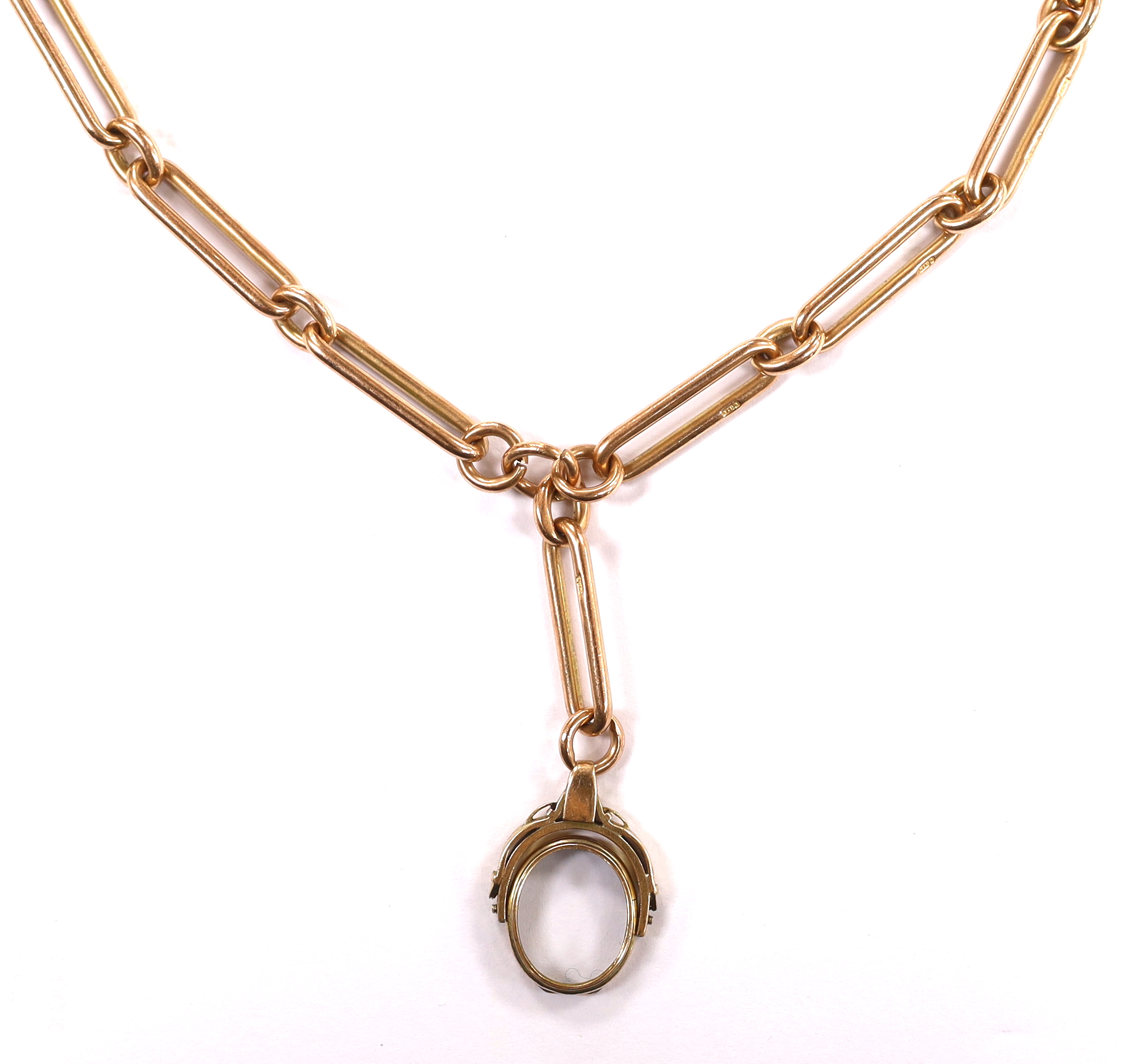 An early 20th century 9ct gold albert, hung with a damaged yellow metal spinning fob, length 43cm